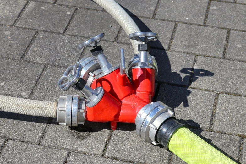 a close up of a hose connected to a fire hydrant, a photo, by Jakob Gauermann, shutterstock, articulated joints, shaded, tripod, colored accurately