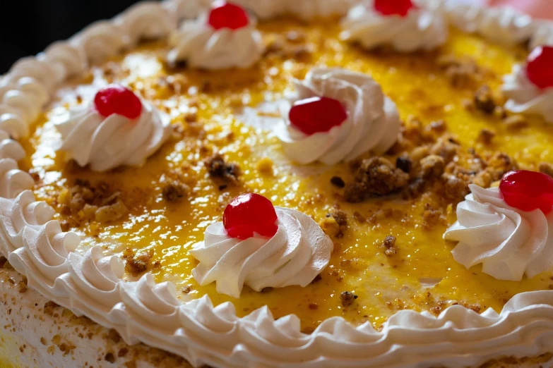 a cake with white frosting and cherries on top, a macro photograph, by Etienne Delessert, renaissance, 4k detail, yellow, very sharp and detailed photo, very very well detailed image