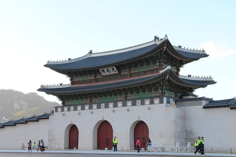 a group of people standing in front of a building, a picture, inspired by Kim Hong-do, flickr, torri gate, monumental giant palace, exterior view, great architecture