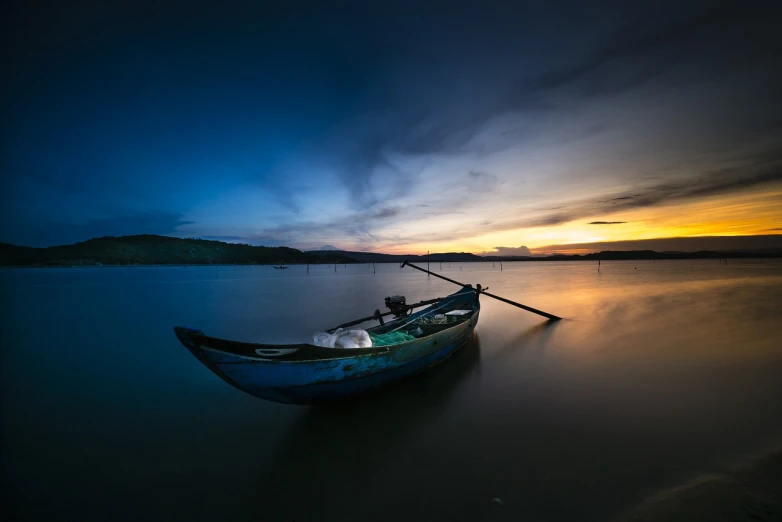 a boat sitting on top of a body of water, a picture, by Basuki Abdullah, shutterstock, low light photography, calm vivid colors, deep colours. ”, lonely scenery yet peaceful!!