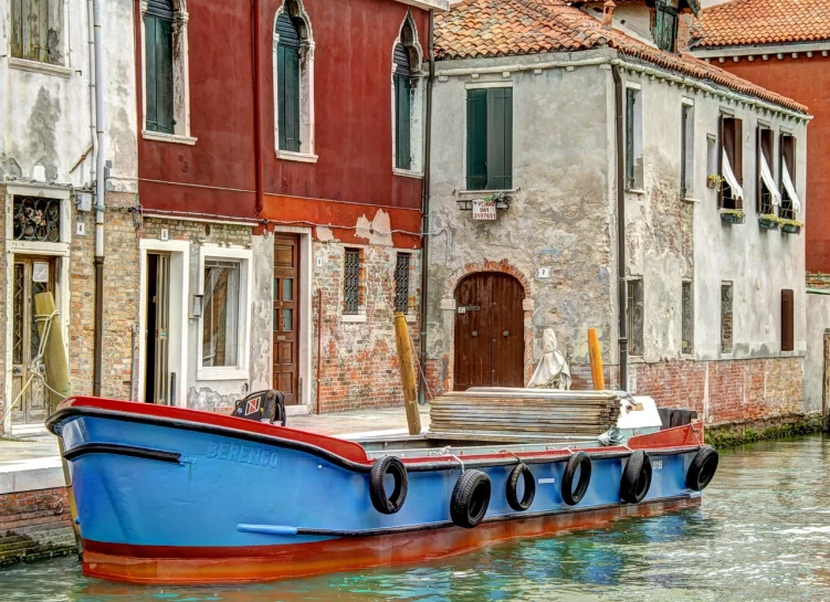 a boat that is sitting in the water, inspired by Quirizio di Giovanni da Murano, shutterstock, fine art, maroon and blue accents, village, hdr detail, house