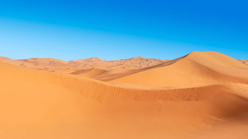 a person riding a horse in the desert, a picture, by Etienne Delessert, shutterstock, fine art, vertical wallpaper, on dune, vibrant orange, panoramic
