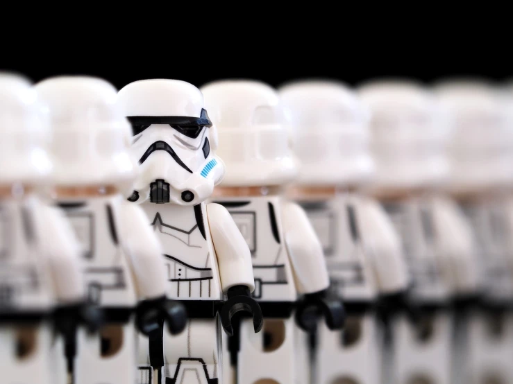 a group of lego stormtroos standing next to each other, a tilt shift photo, getty images, imperial portrait, 3 4 5 3 1, white helmet