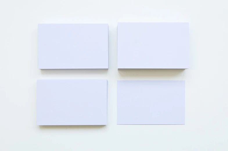 four square pieces of white paper on a white surface, by Jan Rustem, unsplash, cards, triptych, stock photo, no duplicate image