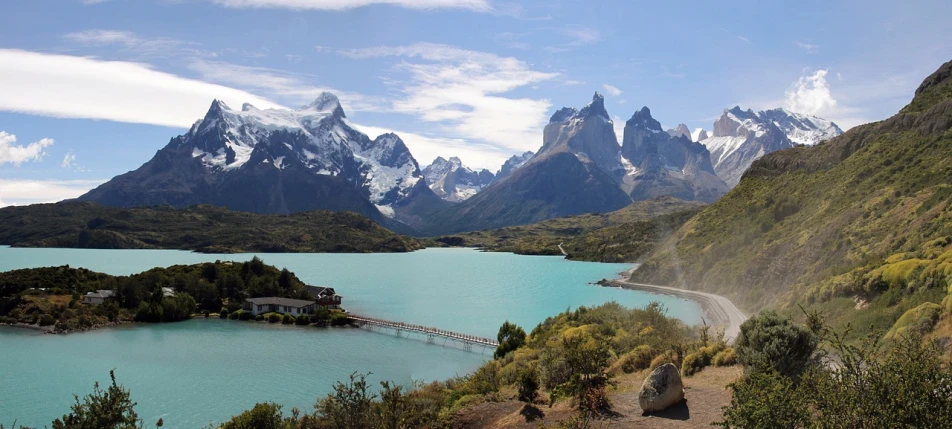 a large body of water surrounded by mountains, by Matteo Pérez, flickr, patagonian, very very very beautiful scenery, well edited, devils horns