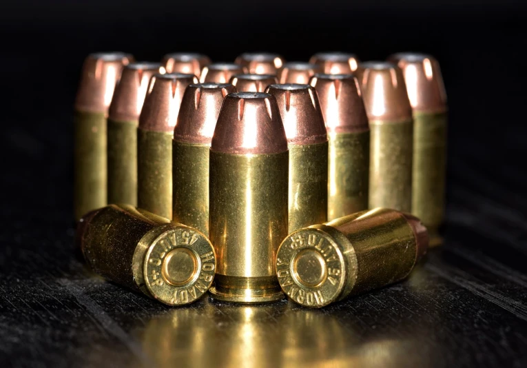 a close up of a bunch of bullet shells, a digital rendering, by Bernardino Mei, pixabay, renaissance, looks like a mix of grimes, p90, upper body close - up, pentagon