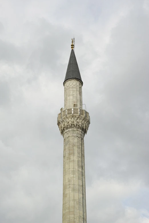 a tall tower with a clock on top of it, hurufiyya, on a cloudy day, ottoman sultan, lead - covered spire, very detaile