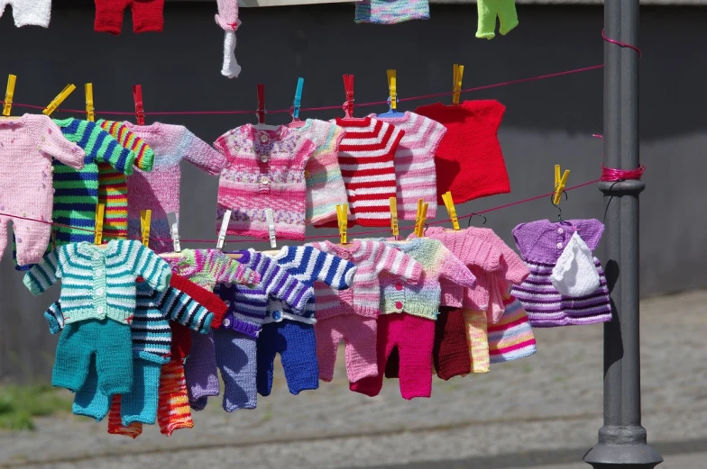 a bunch of clothes hanging on a clothes line, by Anato Finnstark, figuration libre, several dolls in one photo, multicolor, small, sweater