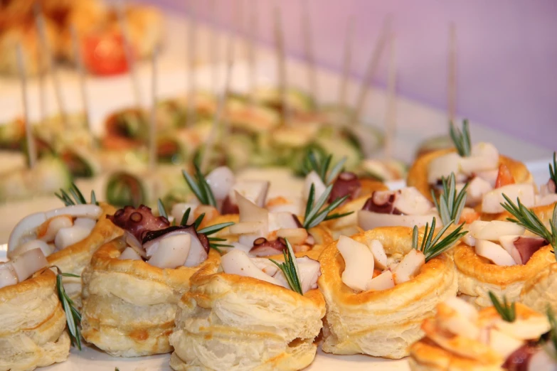 a close up of a plate of food on a table, shutterstock, baroque, pastries, costa blanca, skewer, profile close-up view