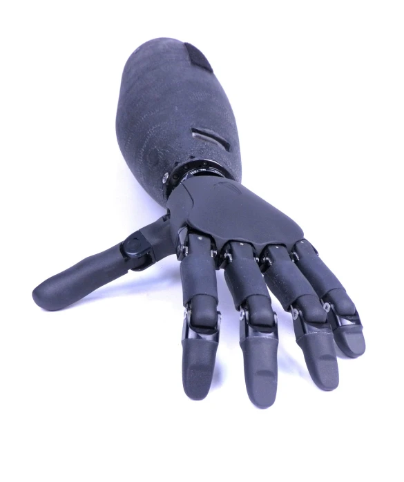 a close up of a robotic hand on a white surface, a portrait, by Rodney Joseph Burn, shutterstock, black leahter gloves, 3/4 view realistic, bamboo, official product photo