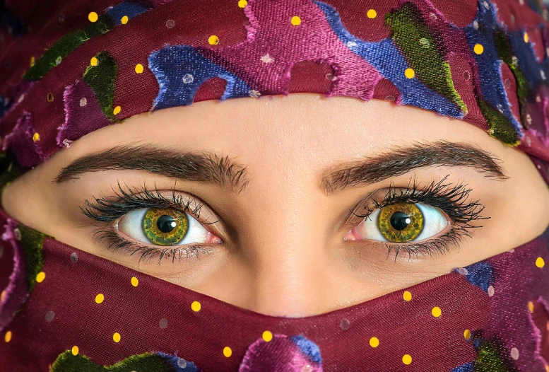 a close up of a person wearing a hijab, a picture, inspired by Maryam Hashemi, shutterstock, colorful eyes, arabian nights, arabian wrestling woman, two perfect eyes