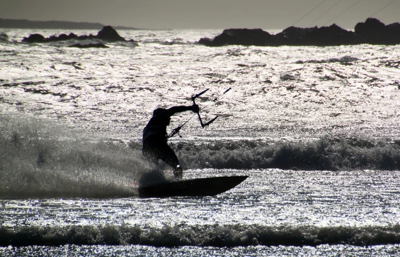 a man riding a wave on top of a surfboard, a picture, by Edward Corbett, pexels, figuration libre, wielding a bow, with backlight, img _ 9 7 5. raw, bone