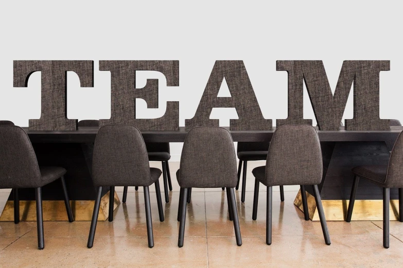 a group of chairs that are sitting in front of a table, by Juan O'Gorman, lettering clean, teams, beam, high res photo