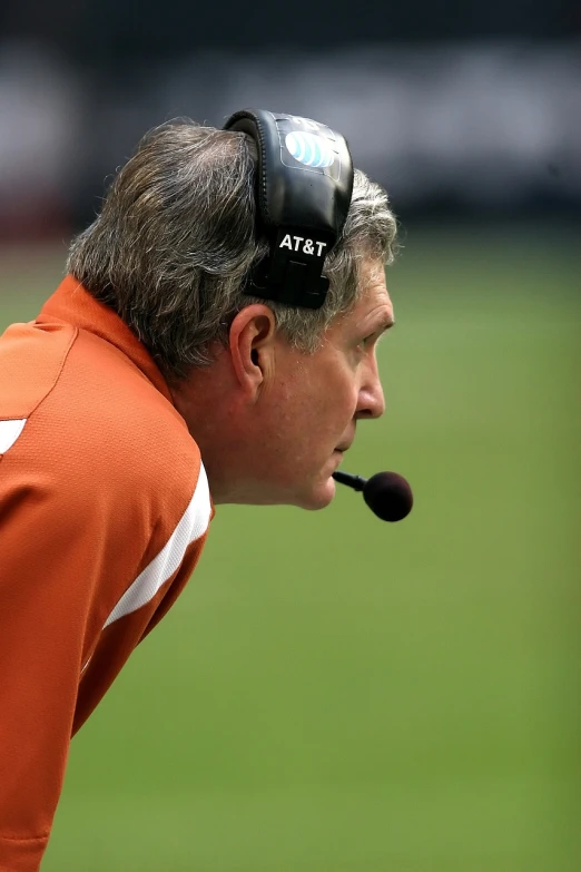 a close up of a person wearing a headset, ditka, focused photo, texas, cone