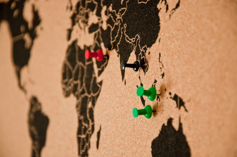 a map of the world with pins on it, a tilt shift photo, by Caroline Mytinger, british stopmotion, ebay, mikko, spotlight