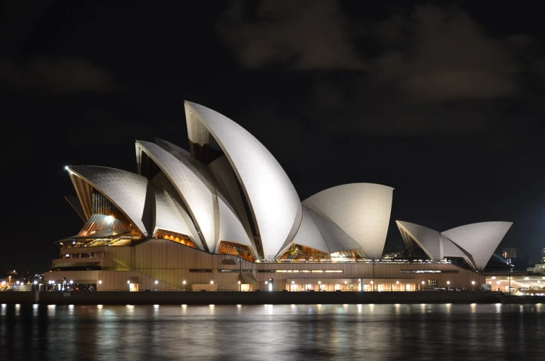 the sydney opera house lit up at night, shutterstock, architectural photograph, deserted, stock photo, stacked image