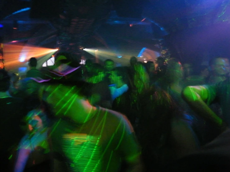 a group of people dancing at a party, flickr, psytrance, haze over the shoulder shot, taken with a pentax1000, nightclub