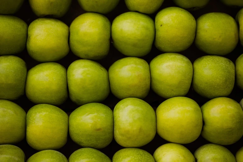 a pile of green apples sitting on top of each other, a picture, by Frederik Vermehren, rounded shapes, in rows, mango, a close-up