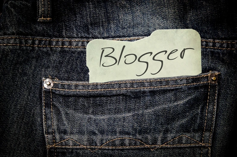 a piece of paper with the word blogger written on it, a photo, by Kurt Roesch, pixabay, baggy jeans, blessed, with two front pockets, ¯_(ツ)_/¯