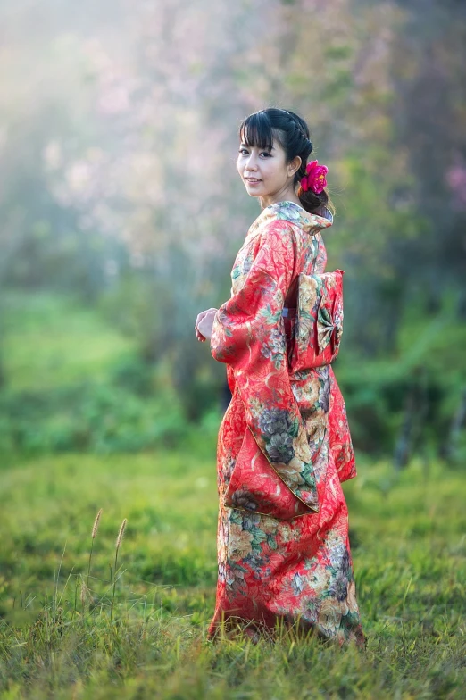 a woman in a kimono standing in a field, shutterstock, young asian girl, stock photo, attractive photo, with a beautifull smile
