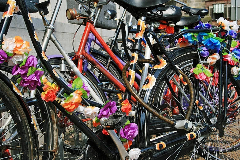 a row of bicycles parked next to each other, by Frederik Vermehren, flickr, kitsch movement, wrapped in flowers and wired, celebrating day of the dead, colorful”, y2k”