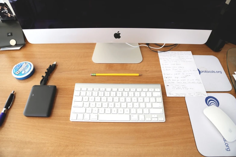 a desktop computer sitting on top of a wooden desk, a picture, minimalism, applepencil, clean photo, writing a letter, maintenance