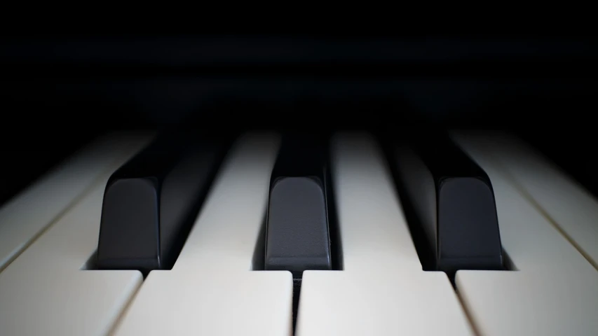 a close up of the keys of a piano, a macro photograph, by Niko Henrichon, unsplash, minimalism, benjamin vnuk, computer generated, with dramatic lighting, lined up horizontally