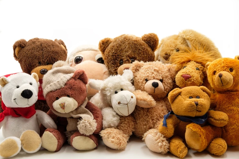 a group of teddy bears sitting next to each other, mixture animal, with a white background, fluffly!!!, toy room