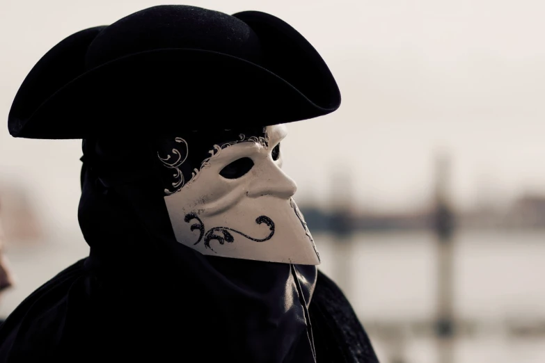 a close up of a person wearing a mask, inspired by Pietro Longhi, shutterstock, romanticism, at the waterside, portrait of a vigilante, 2 0 2 2 photo