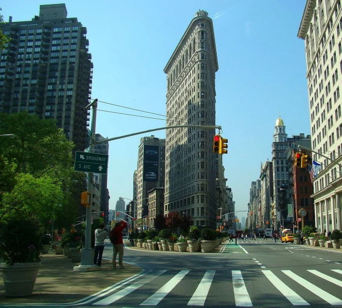 a city street filled with lots of tall buildings, art nouveau, usa-sep 20, stony, monuments, beautiful daylight