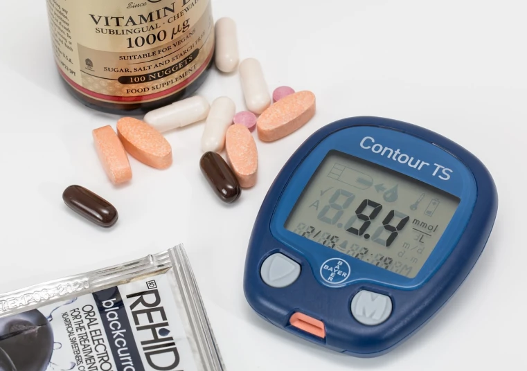 a close up of a thermometer and pills on a table, a picture, pixabay, bauhaus, snacks, set against a white background, brown, digital display