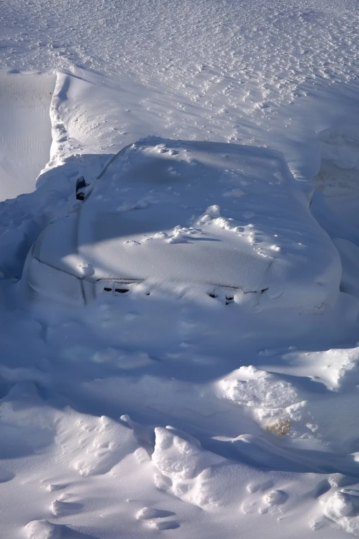 a car that is sitting in the snow, a portrait, auto-destructive art, down there, mid shot photo