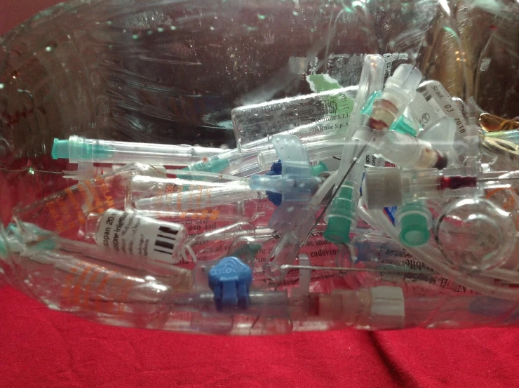 a plastic container filled with assorted medical supplies, a picture, by Matija Jama, reddit, plasticien, syringes, ooak, water bottles, lot of foam