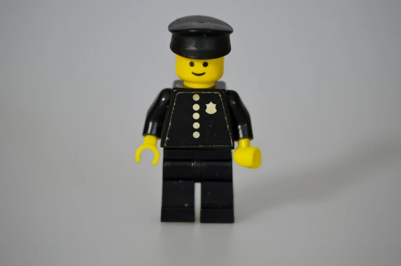 a close up of a lego man wearing a hat, a picture, figuration libre, policeman, mid 2 0's female, full length character, man in black