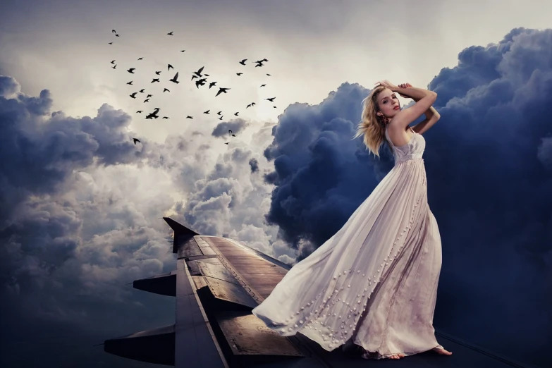 a woman in a white dress standing on top of an airplane, digital art, inspired by irakli nadar, pixabay contest winner, romanticism, annasophia robb as aphrodite, retouched in photoshop, wearing a long dress, jingna zhang