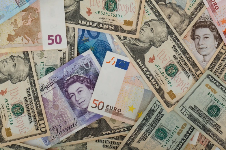 a pile of money sitting on top of a table, a portrait, pexels, baroque, currency symbols printed, high detail product photo, world, usa-sep 20