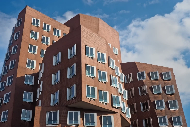 a very tall building with lots of windows, inspired by Washington Allston, shutterstock, frank gehry architecture, boston massachusetts, penrose stairs, high res photo