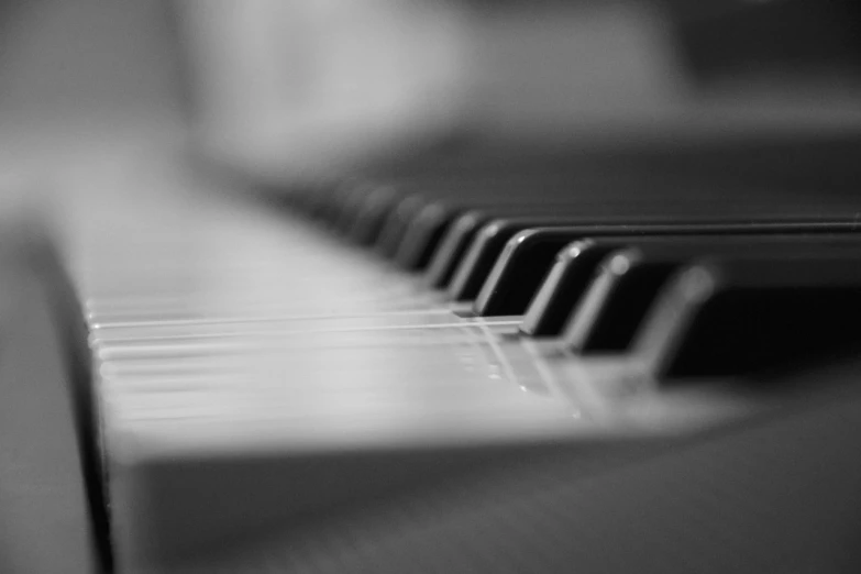 a close up of the keys of a piano, a macro photograph, by Matija Jama, 4k greyscale hd photography, very short depth of field, wallpaper mobile, smooth lines