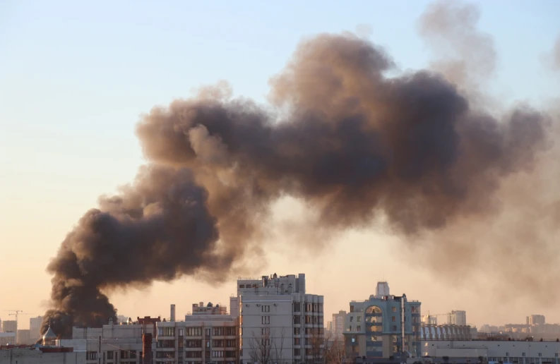 black smoke billowing from the top of a building, by Steven Belledin, shutterstock, damascus, war in ukraine, 2 0 2 2 photo, 1 3 5 mm