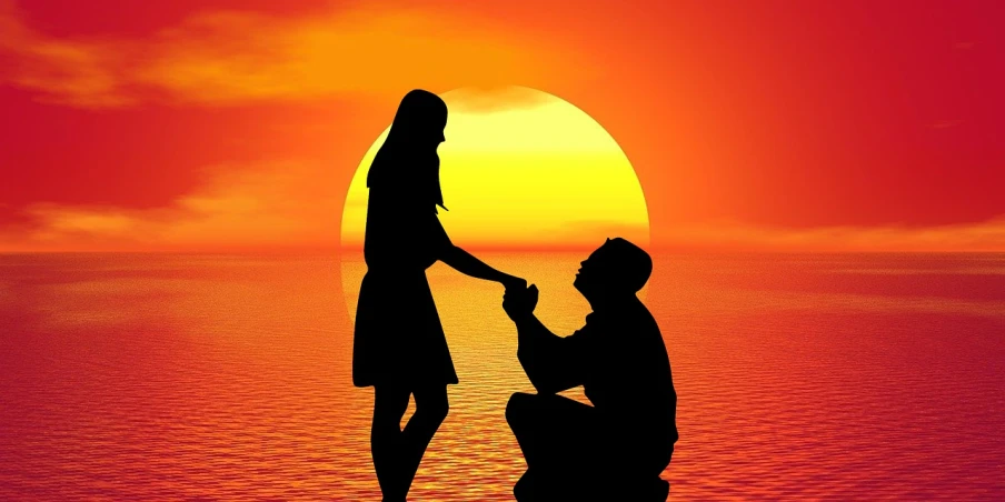 a man kneeling next to a woman in front of a sunset, a picture, pixabay, romanticism, man proposing his girlfriend, in front of an orange background, ! holding in his hand !, love os begin of all