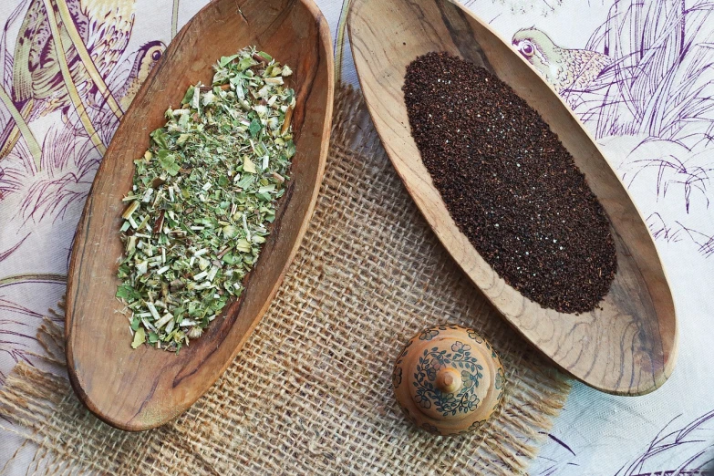 a couple of wooden spoons sitting on top of a table, dried herbs, ayanamikodon and irakli nadar, tea, “organic