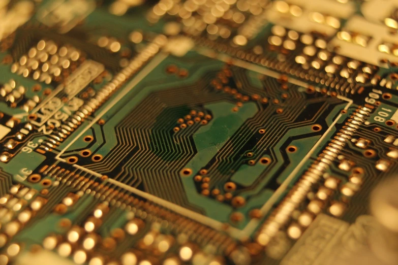 a close up of a printed circuit board, by Dan Christensen, flickr, inlaid with gold, looking partly to the left, crypto, bay area