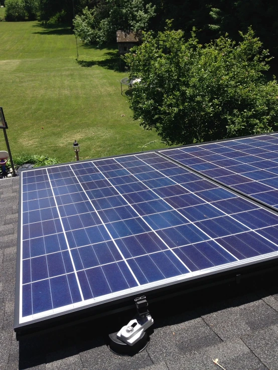 a solar panel on the roof of a house, by Carey Morris, cg society contest winner, renaissance, oh yeah, close up shot from the top, flat panels, beautiful view