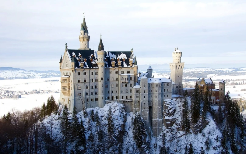 a castle sitting on top of a snow covered mountain, by Werner Gutzeit, flickr, gothic building style, wintry rumpelstiltskin, snow white, masterpiece”