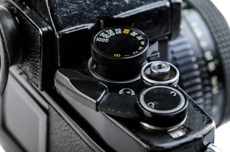 a close up of a camera on a white surface, a macro photograph, by Jason Felix, dials, nostalgic high saturation, detailed medium format photo, close up shot a rugged