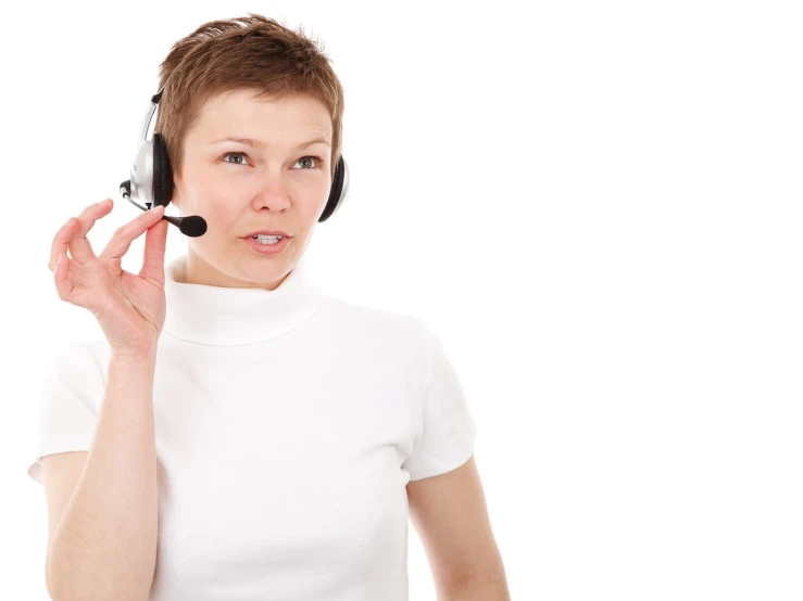 a close up of a person wearing a headset, a photo, by Aleksander Gierymski, shutterstock, isolated on whites, female in office dress, brocade, warm friendly expression