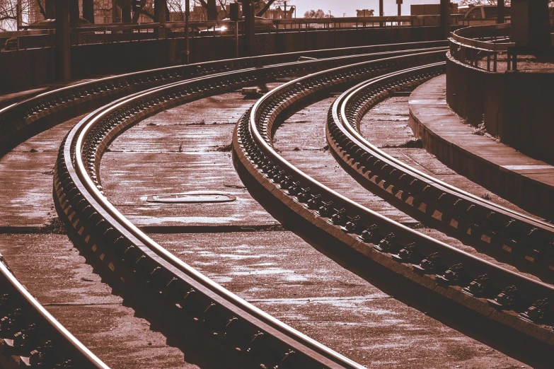 a couple of train tracks sitting next to each other, a picture, by Richard Carline, twirls and curves, retro effect, random circular platforms, industrial background