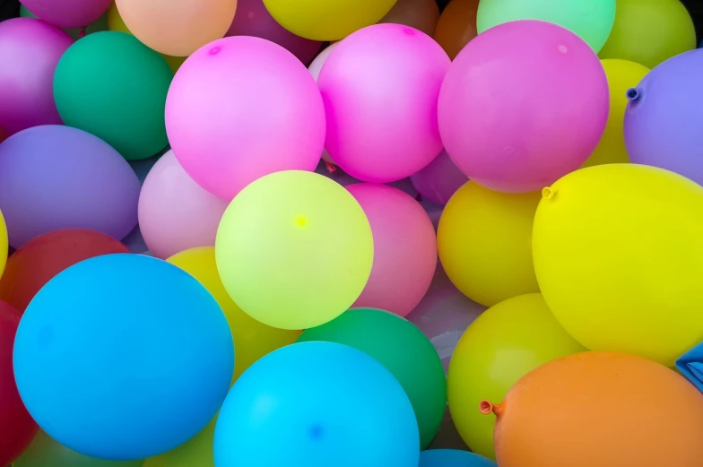 a bunch of colorful balloons floating in the air, a picture, inspired by Peter Alexander Hay, color field, celebrating a birthday, insanely inflated hips, flourescent colors, up close