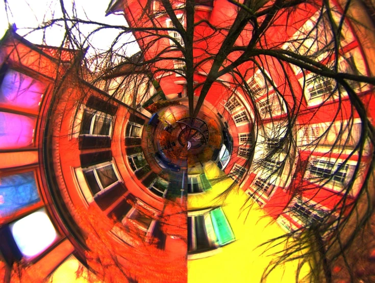 a circular picture of a building with a tree in front of it, a picture, flickr, panfuturism, bright colors ultrawide lens, kreuzberg, gateway to another dimension, red+yellow colours