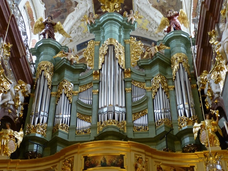 a green and gold pipe organ in a church, inspired by Johann Ludwig Aberli, baroque, prague, dominik mayer, higher details, benjamin vnuk